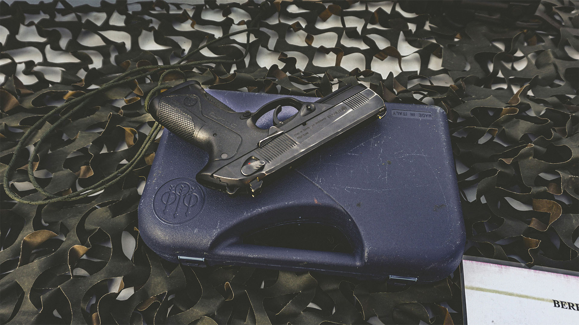 handgun lying on blue case