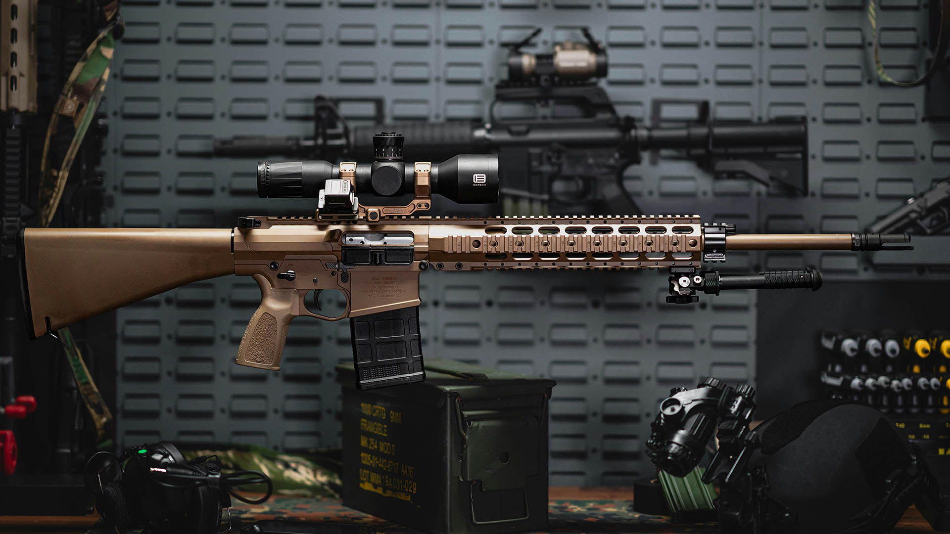 Rifle and firearm accessories on a table