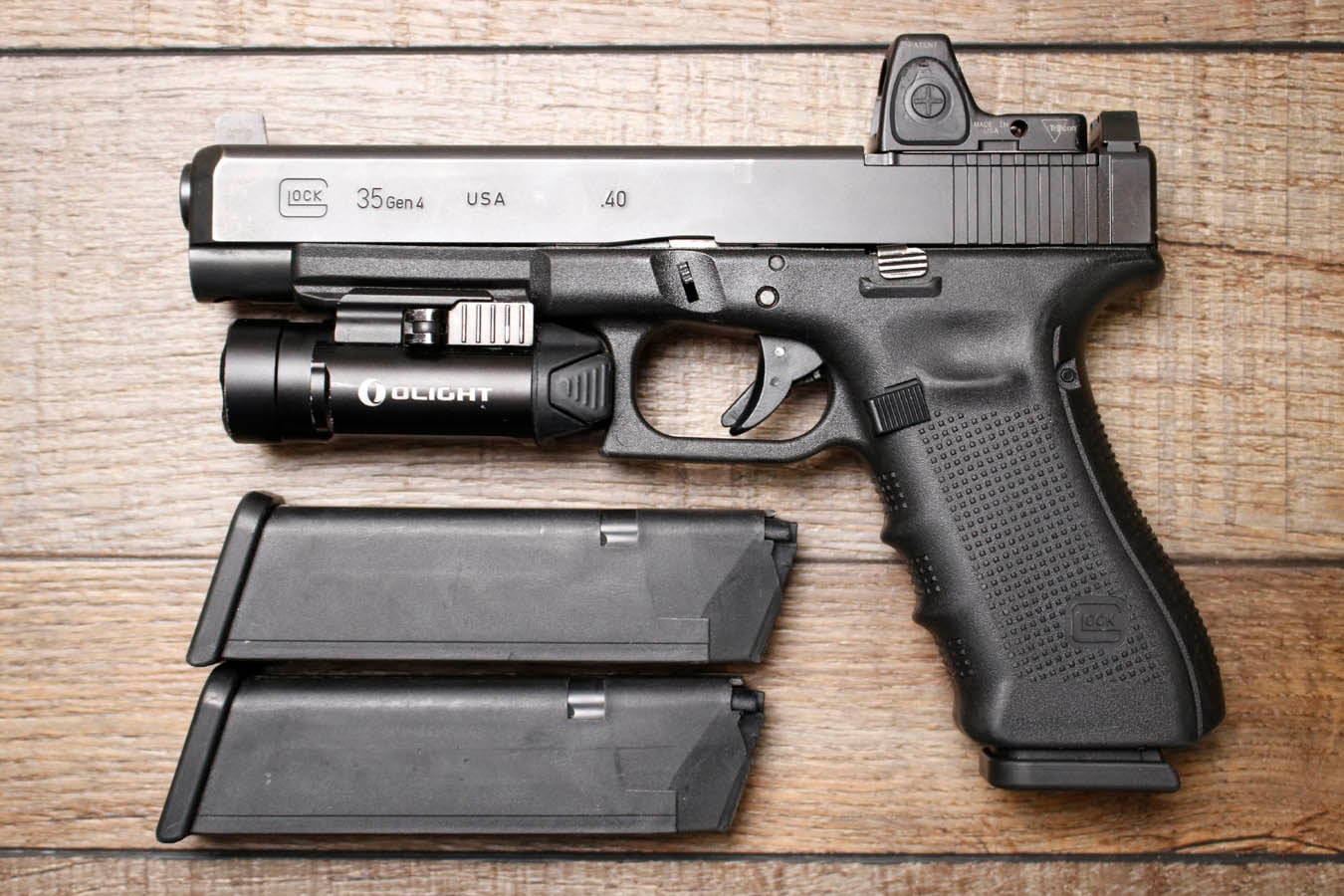 Glock 35 Gen 4 MOS 40 S&W Police Trade-In Pistol with Trijicon RMR Red Dot and PL-2 Light