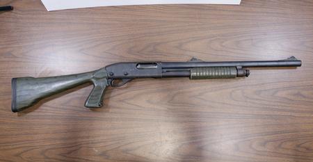 870 EXPRESS MAGNUM 12 GAUGE POLICE TRADE-IN PUMP SHOTGUN WITH CAMO STOCK AND FI