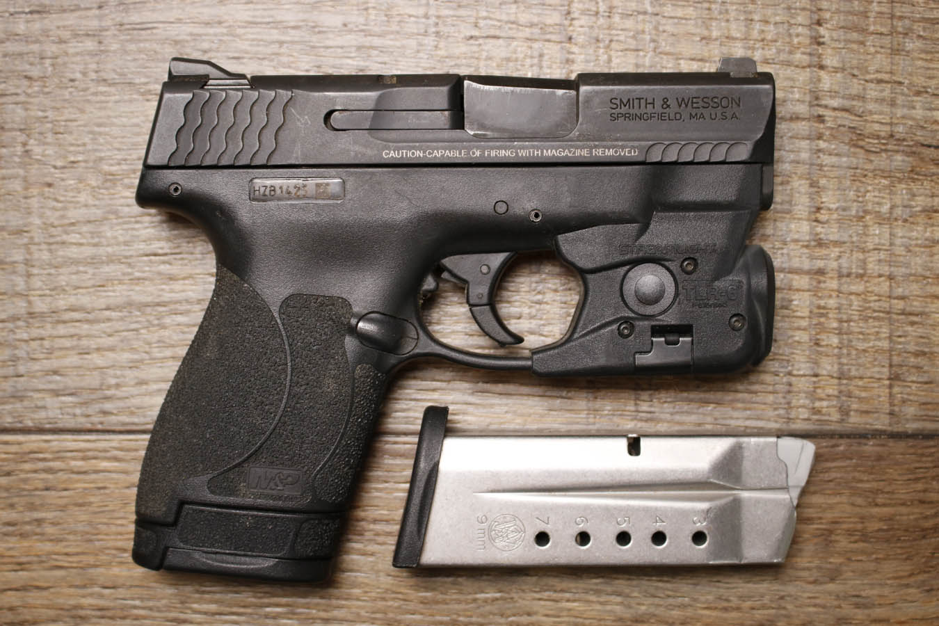 SMITH AND WESSON M&P9 Shield M2.0 9mm Police Trade-In Pistol with TLR-6 Flashlight/Laser