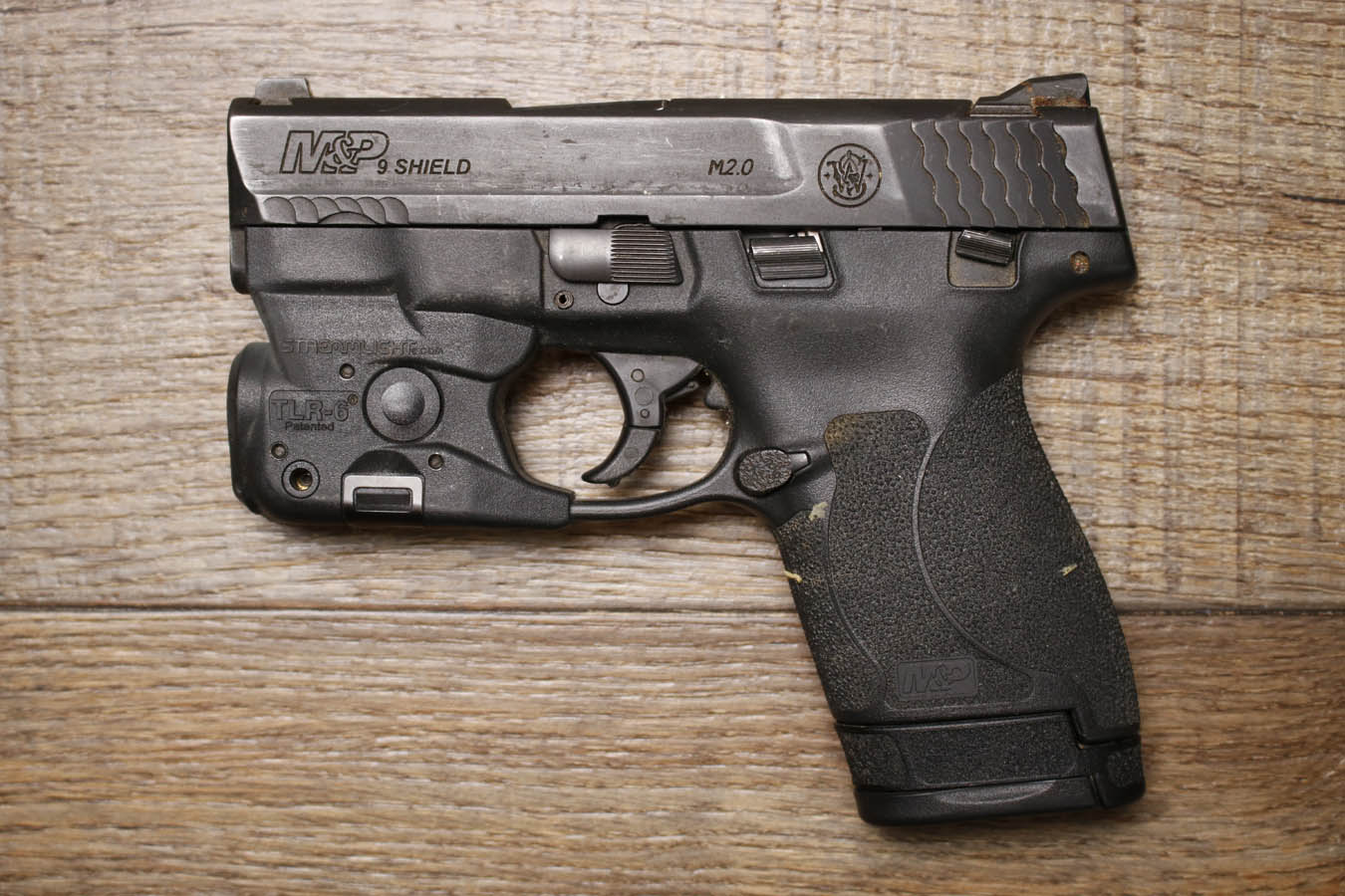 SMITH AND WESSON M&P9 Shield M2.0 9mm Police Trade-In Pistol with TLR-6 Flashlight/Laser